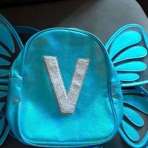 A cute little butterfly bag for your little one with a V on it!